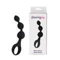 The SweetTemptation – Triple Motion Wellness Massager by SweetTemptation.nl is shown with its box. This compact silicone toy features three graduated beads for enhanced pleasure and comfort, complete with a looped handle for easy use.